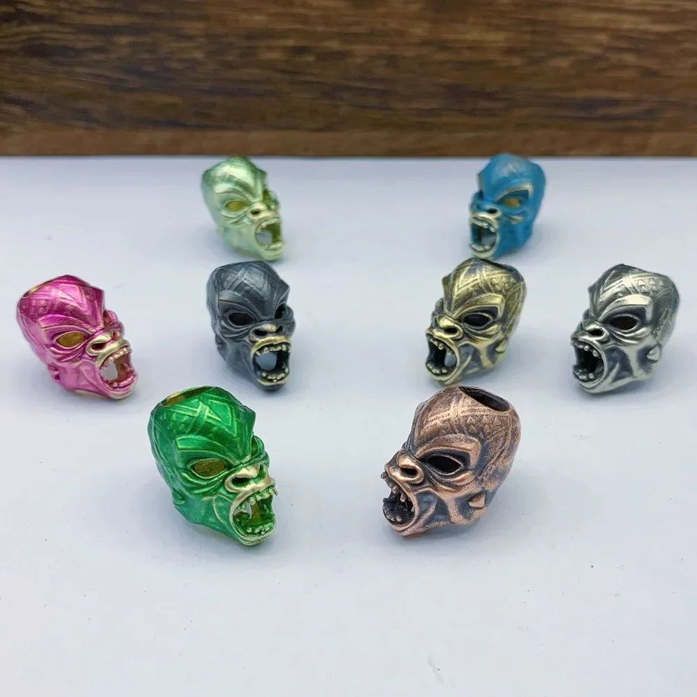 

1pcs Vintage DIY Copper Mask Knife Beads Rope Brass Masked Skull Paracord Beads Key Rings Accessories