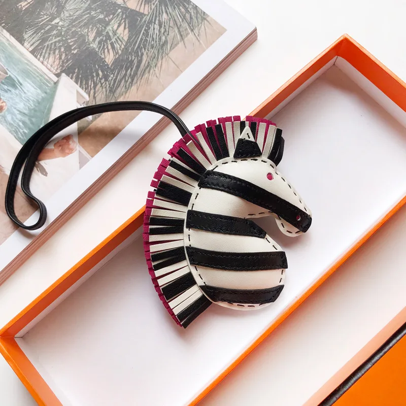 

Hand-Stitched Tassel Sheepskin Zebra Head Bag Charm Unicorn Horse Head Pendant Car Keychain Hanger Luxury Accessory