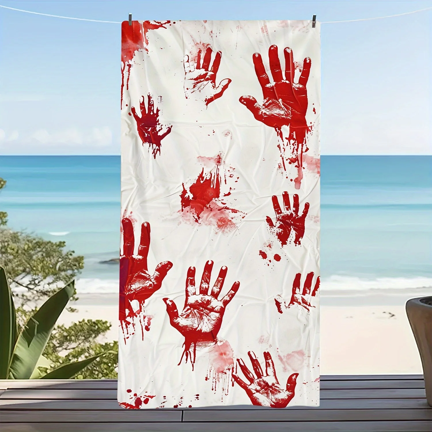 

Oversized microfiber beach towel adorned with afantastical bloodstained handprint pattern Modern style perfect forbeach and pool