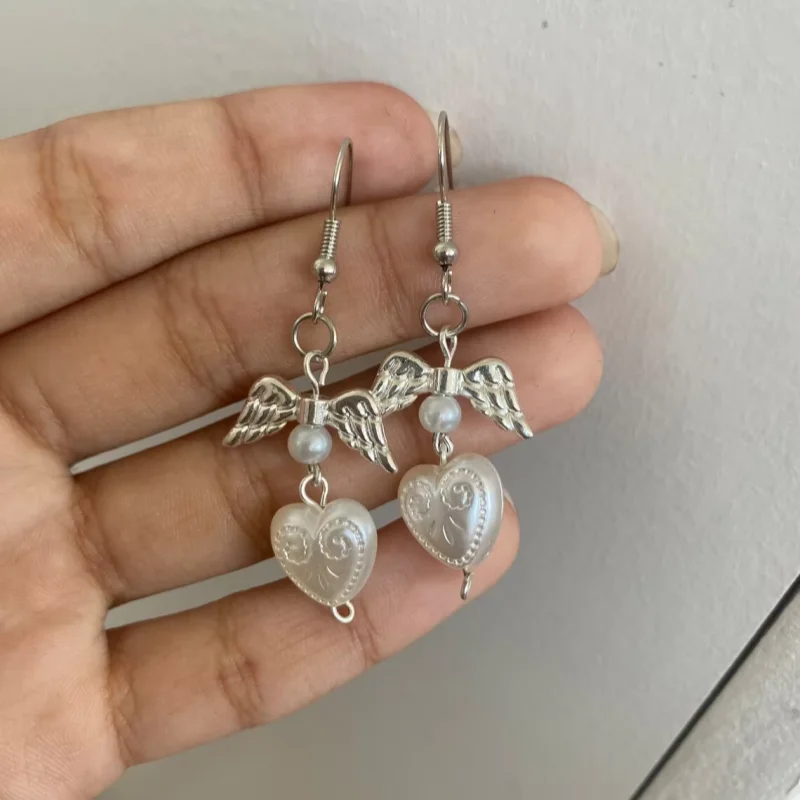 white coquette pearl angel earrings