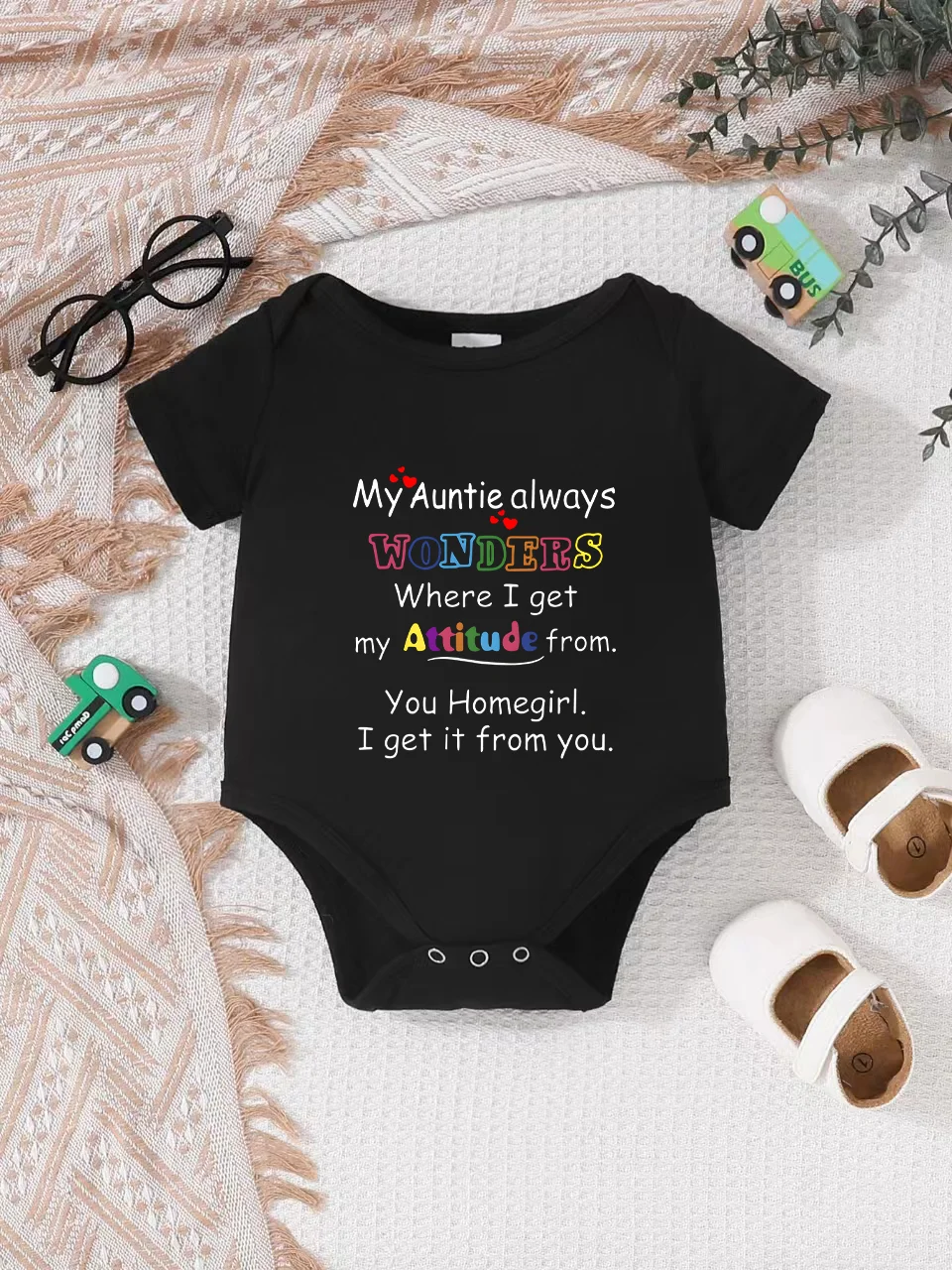 Playful letter-printed baby short-sleeve triangle bodysuit. Button closure for easy dressing