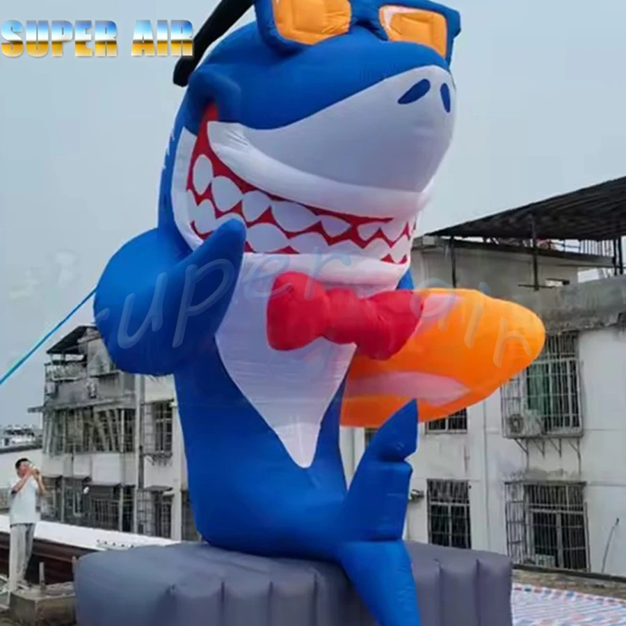 Beautiful marine organism model smile inflatable shark hold the slide and waring sunglasses for sale