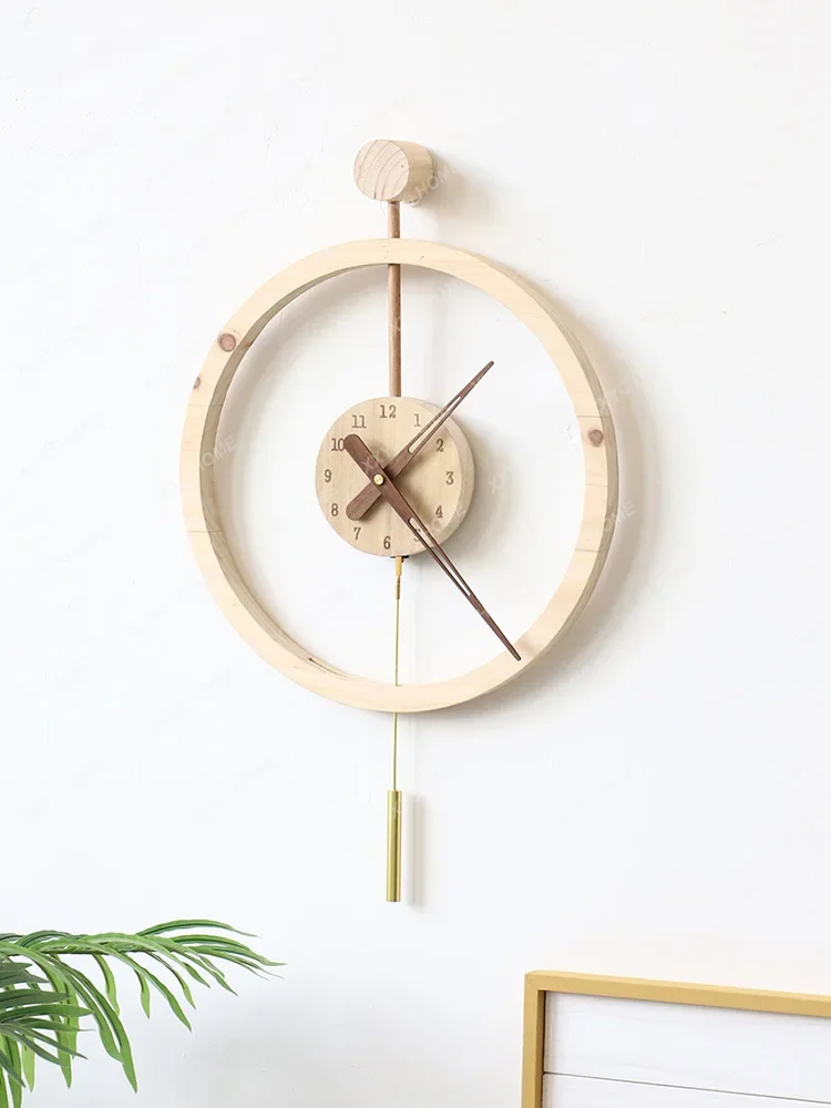 Creative solid wooden wall clock, living room, home atmosphere, clock, and hanging watch 2023 new light luxury, no punching wall