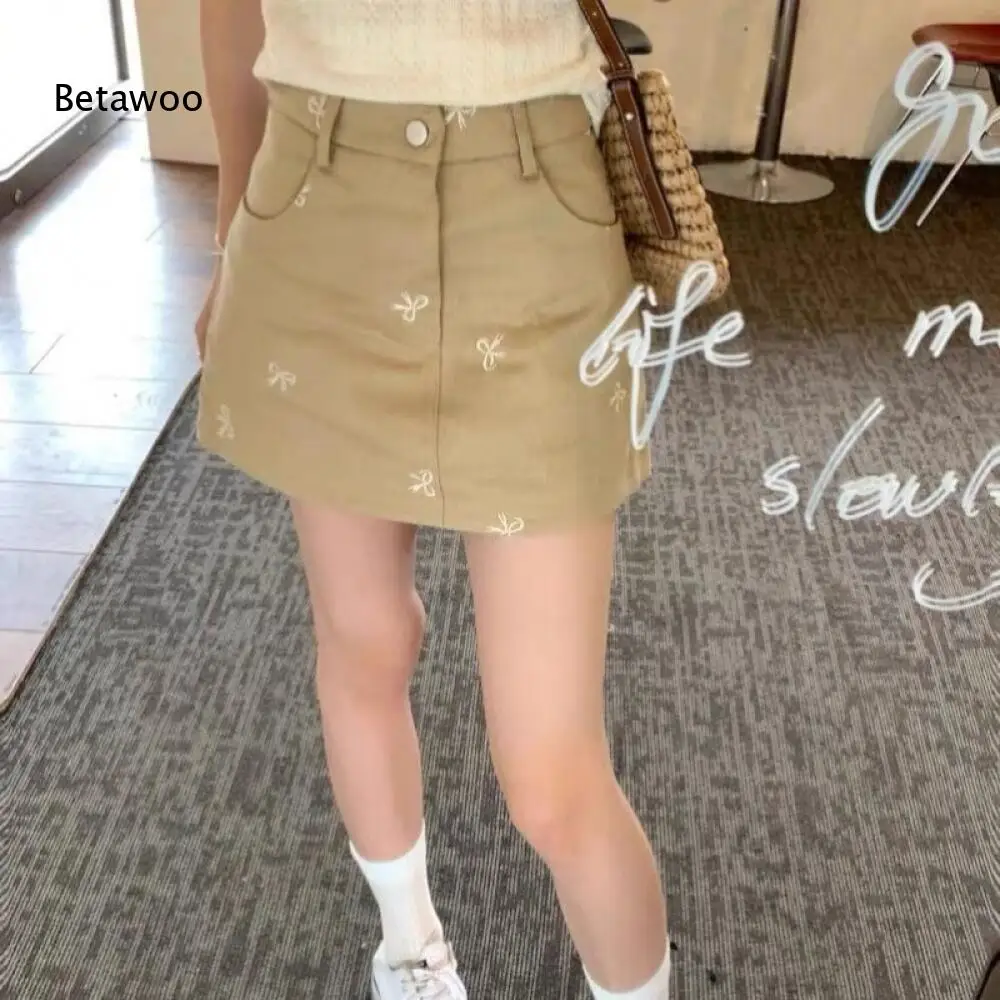 

Womens Beige Bow Embroidery Button Front Mini Skirt
