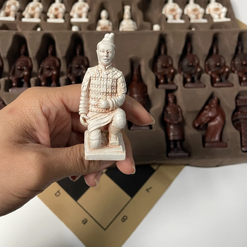 

Large-scale chess game with deliberately aged three-dimensional character designs and heavy chess pieces for entertainment
