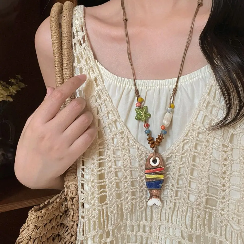 

Retro Vintage Ceramic Fish Necklace Tassel Wood Ethnic Style Necklace Bead Woven Rope Long Sweater Chain Jewelry Accessories