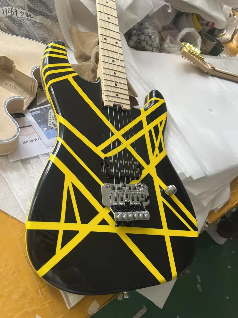 

Guitar factory exports 6-string electric guitars，Maple neck ，Black body yellow strip，Floyd rose bridge,Free delivery