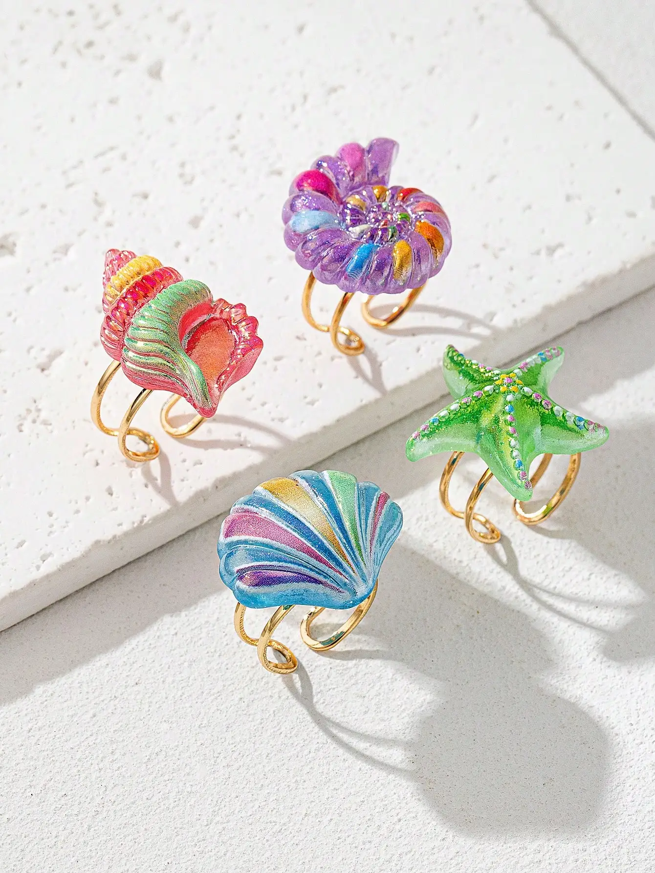 4 anillos ajustables de acrílico con motivos marinos coloridos para mujer: diseños de estrella de mar, concha y nautilus
