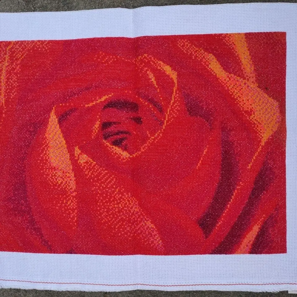 The finished product of cross stitch is handmade and embroidered with a resounding rose. The living room, bedroom, and study are