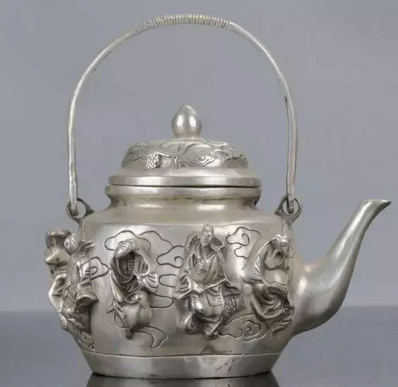 

Chinese Silver Copper Handwork Carved The Eight Immortals Teapot