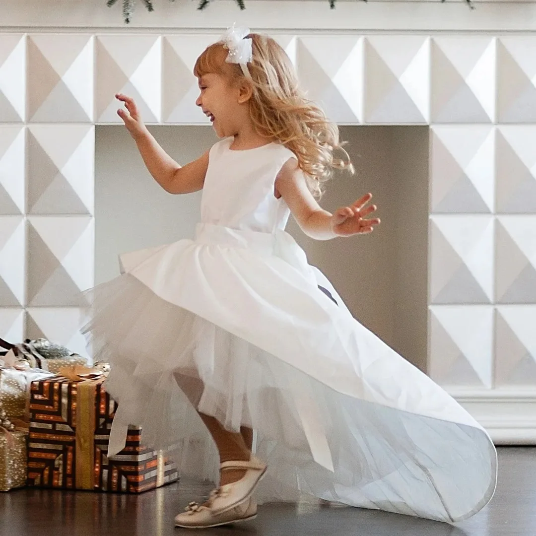 Custom Flower Girl Dress White Tulle and Satin with Bow, High-Low Design Suitable for Weddings, Birthday Parties, and Communion