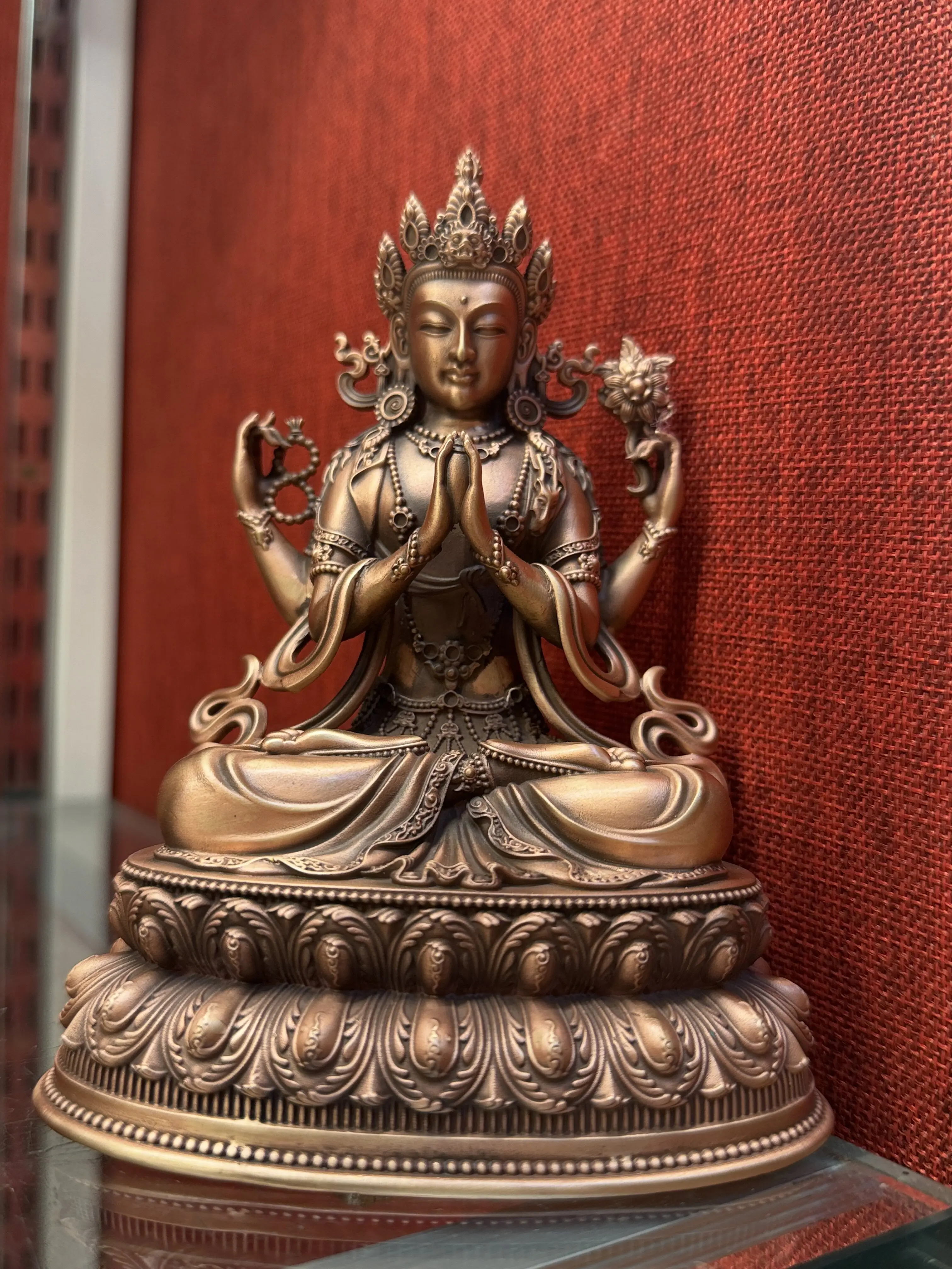 The four-armed Guanyin pure purple bronze Buddha statue stands 15 centimeters tall