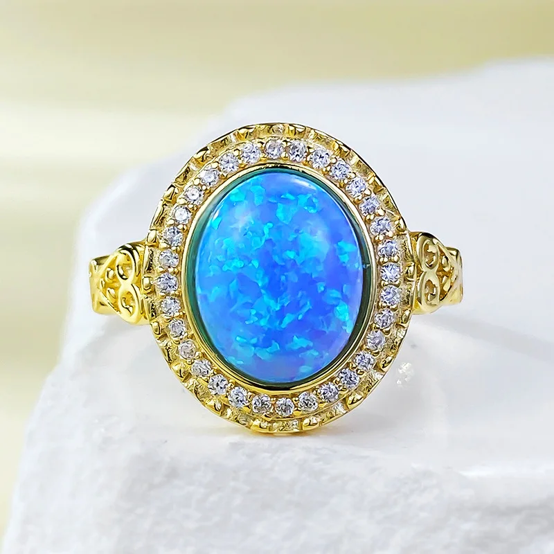 

Mujing Jewelry New 925 Silver Plated Gold Inlaid 8 * 10mm Oval Aobao Opal Blue Ring for Border Women