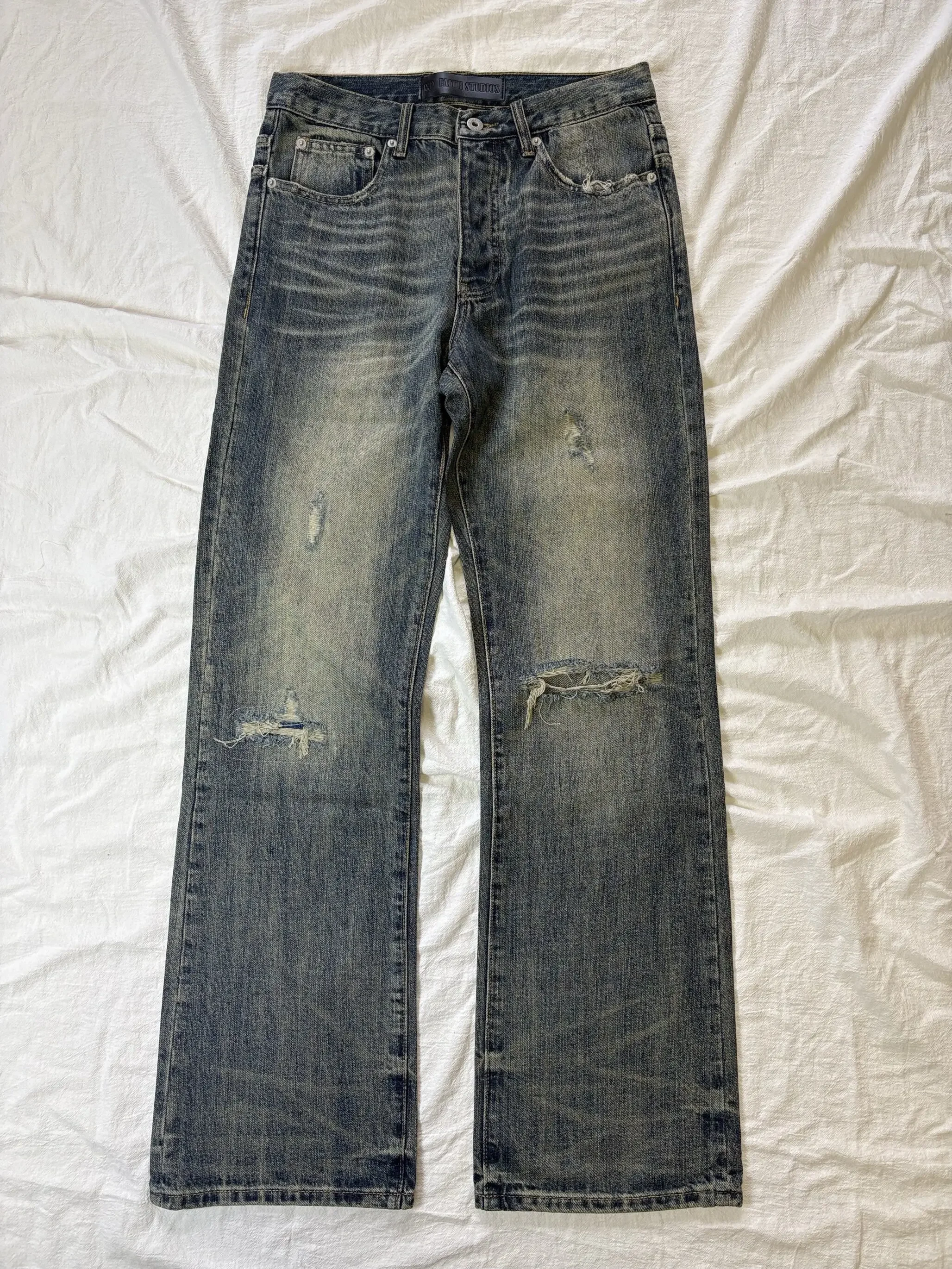 

No faith studios sun fading washed old hand cut holes heavy industry patch straight jeans