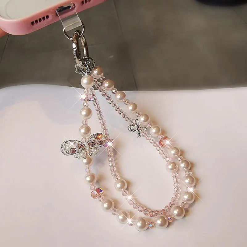 Bracciale da polso con cordino per telefono in cristallo scintillante con catena per telefono con fiocco di lusso e perla per accessori per custodie per telefoni