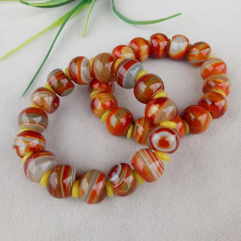 Jewelry: Ancient-style red , silk-wrapped agate , "Sky Eye" bracelet, couple's accessory
