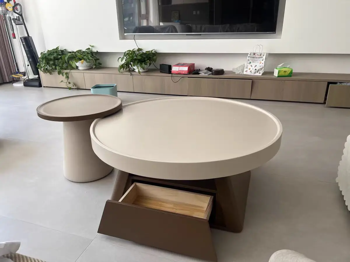 A combination of small units in the living room, family, cream style circular coffee table, antique style table, large and small