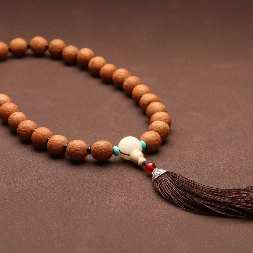 Authentic Natural Nepali Phoenix-Eyed Bodhi Holds A Bead Bracelet Tassel.