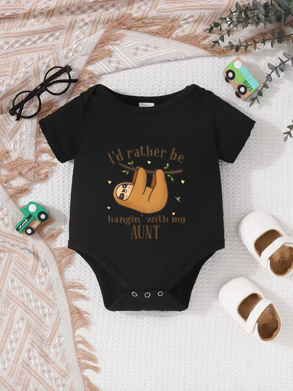Playful letter-printed baby short-sleeve triangle bodysuit. Button closure for easy dressing, machine washable