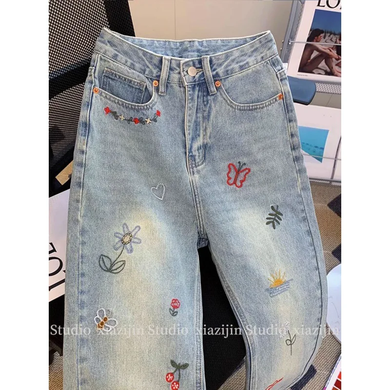 

Printed high-waist jeans women's new retro design in autumn 2024 with a sense of raw edges and straight loose cropped trousers.