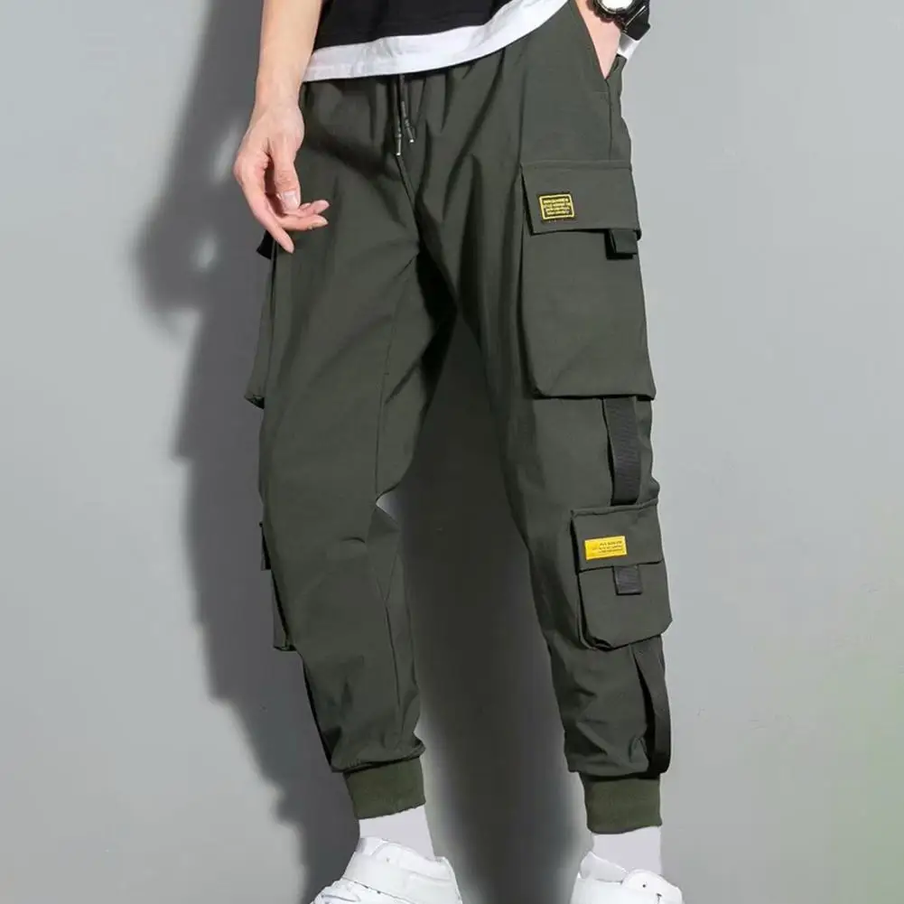 

Men Cargo Pants Multi Pockets Strap Decor Loose Drawstring Elastic Waist Plus Size Daily Wear Streetwear Long Work pants for men