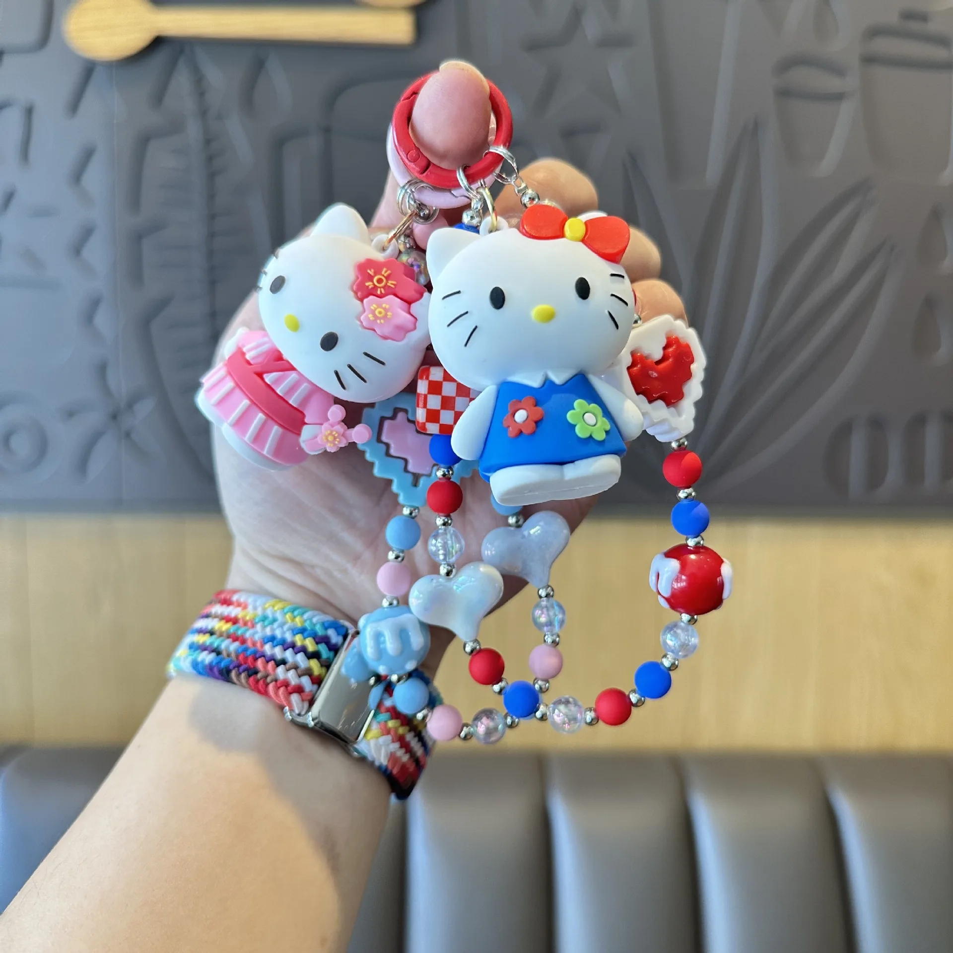 

Sanrio handmade beaded keychain cartoon Kitty cat plush doll phone charm, delicate small pendant for girls' bags.