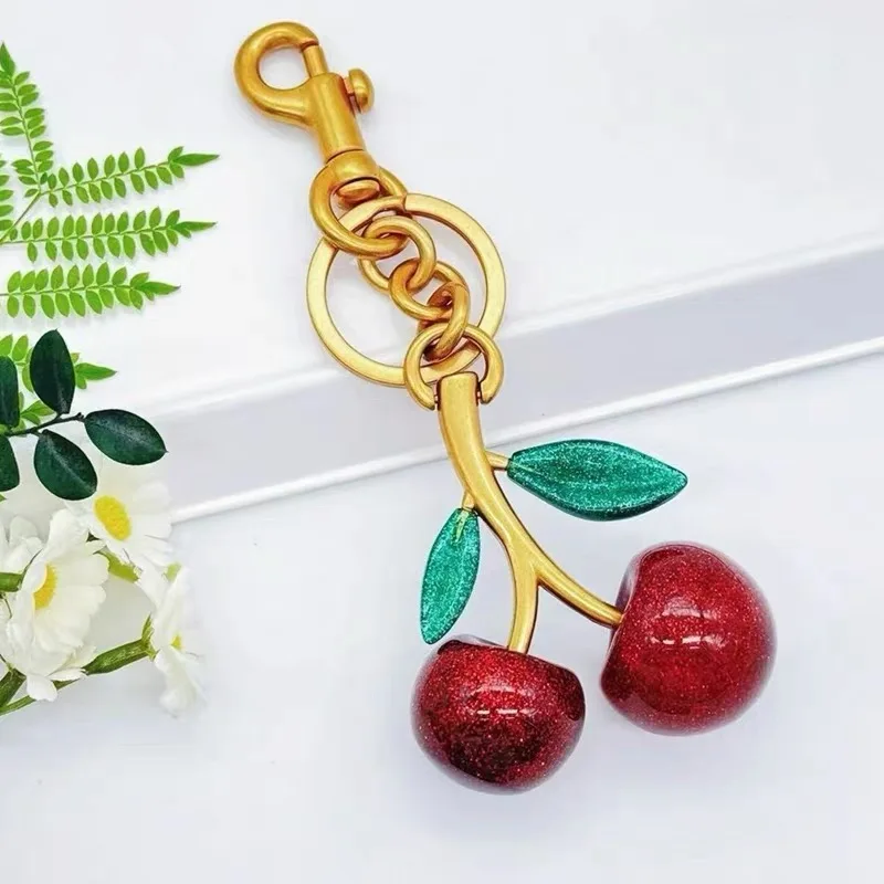 الإنترنت الشهيرة الورقة الخضراء كريستال الكرز قلادة الديكور لمدرب حقيبة يد حقيبة كتف رائعة المفاتيح مرفق جزء