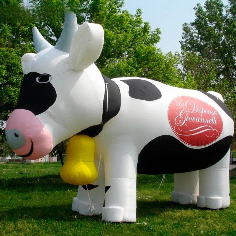 Blown up giant inflatable cow with logo print customized for outdoor events