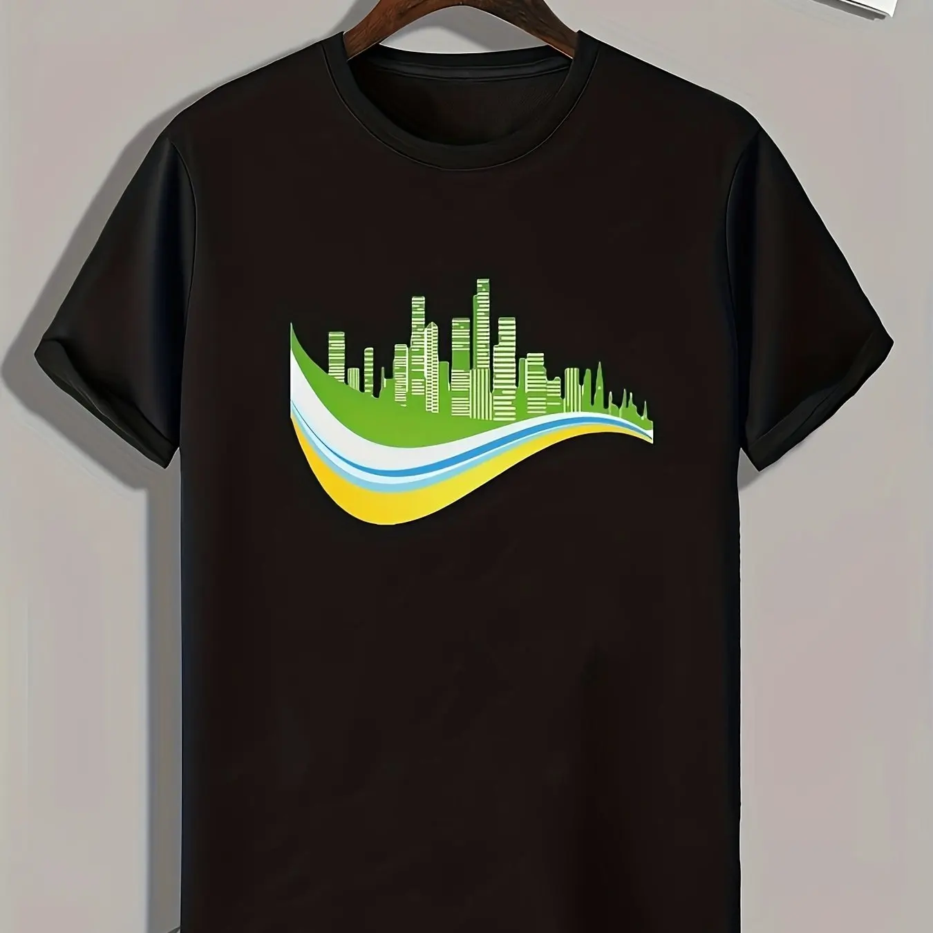 100% cotton black t-shirt featuring a modern cityscape graphic design with green yellow and blue tones perfect for casual wear