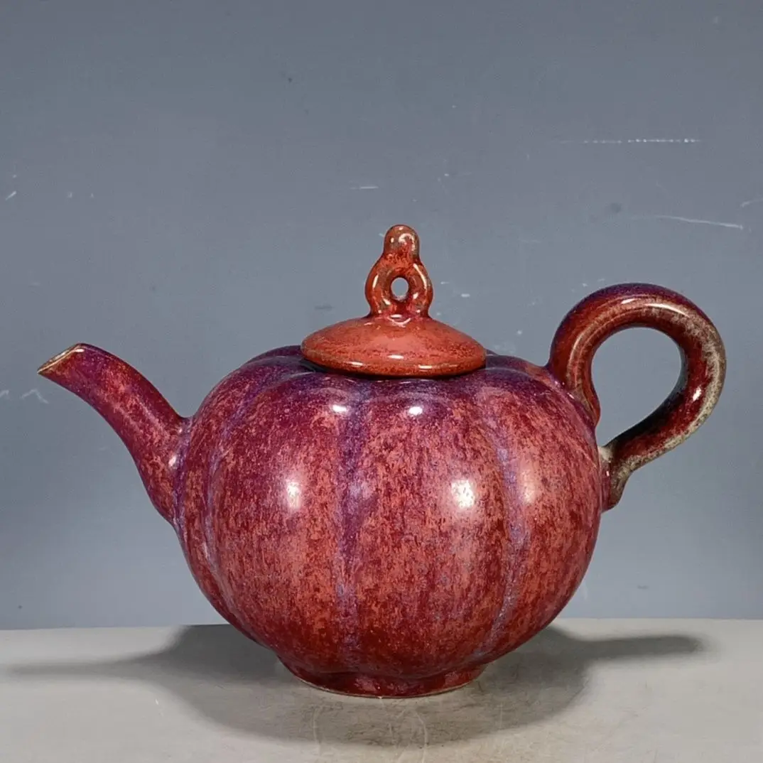 Replica of Chinese antiques and collectibles: Song Dynasty Jun ware kiln-transformed rose-red pumpkin teapot.