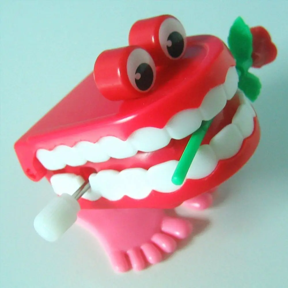 Simpatico plastica per protesi per bambini, denti che camminano a forma di carica, denti a orologeria, rosa a orologeria