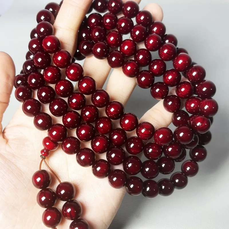 Amber wood 108 red oil blood dragon multi-loop cultural toy bracelet with translucent pine seeds, solidified, for men