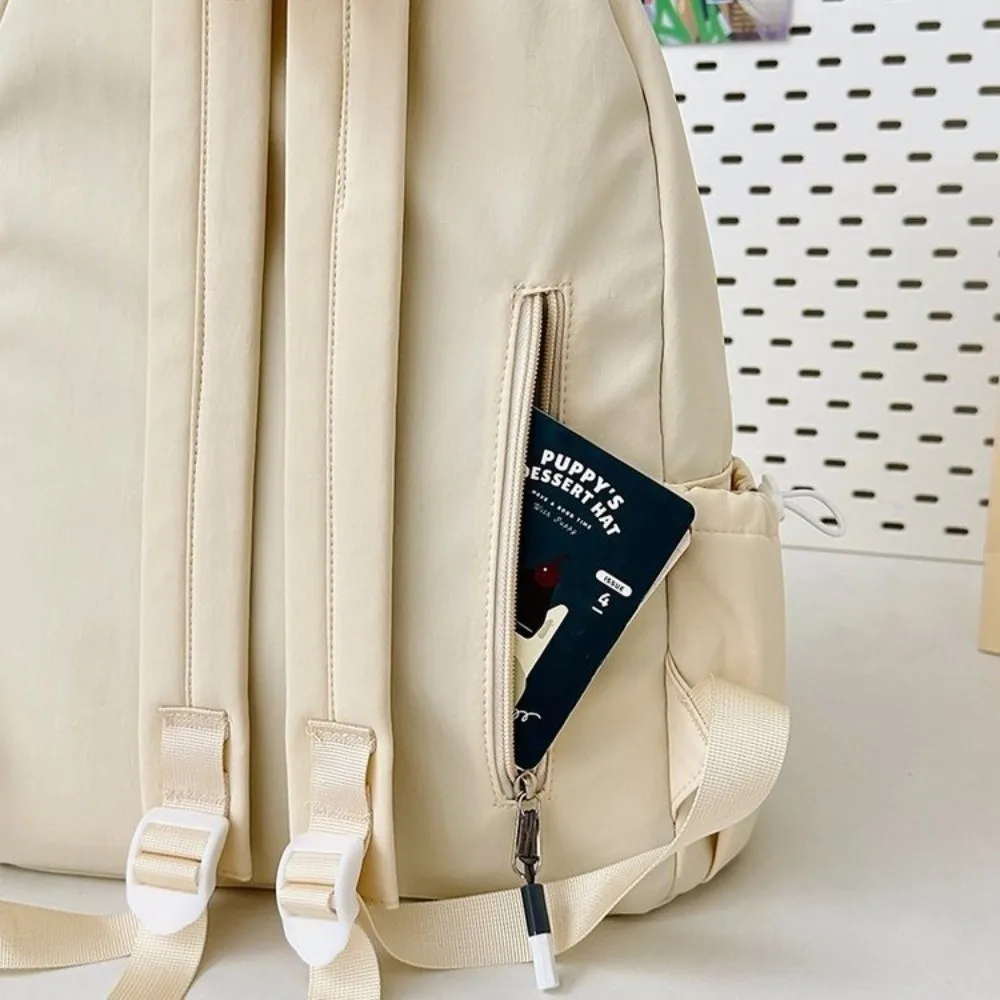 حقيبة ظهر محمولة مطرزة على شكل فيونكة للفتيات من النايلون بسعة كبيرة حقيبة مدرسية للطلاب بلون سادة وخفيفة الوزن للسفر