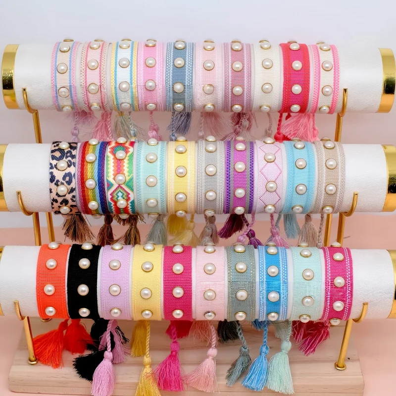 

Bohemia Handmade Rivet Imitation Pearl Wrist Band For Women Hand Woven Flat Knot Tassel Bracelet Customize Logo Fashion Jewelry
