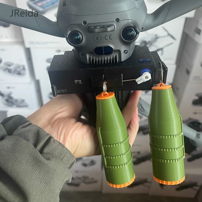 Dual-function drone airdrop igniter, quick-release installation, Mavic 4 outdoor aerial photography drop ignition accessory.