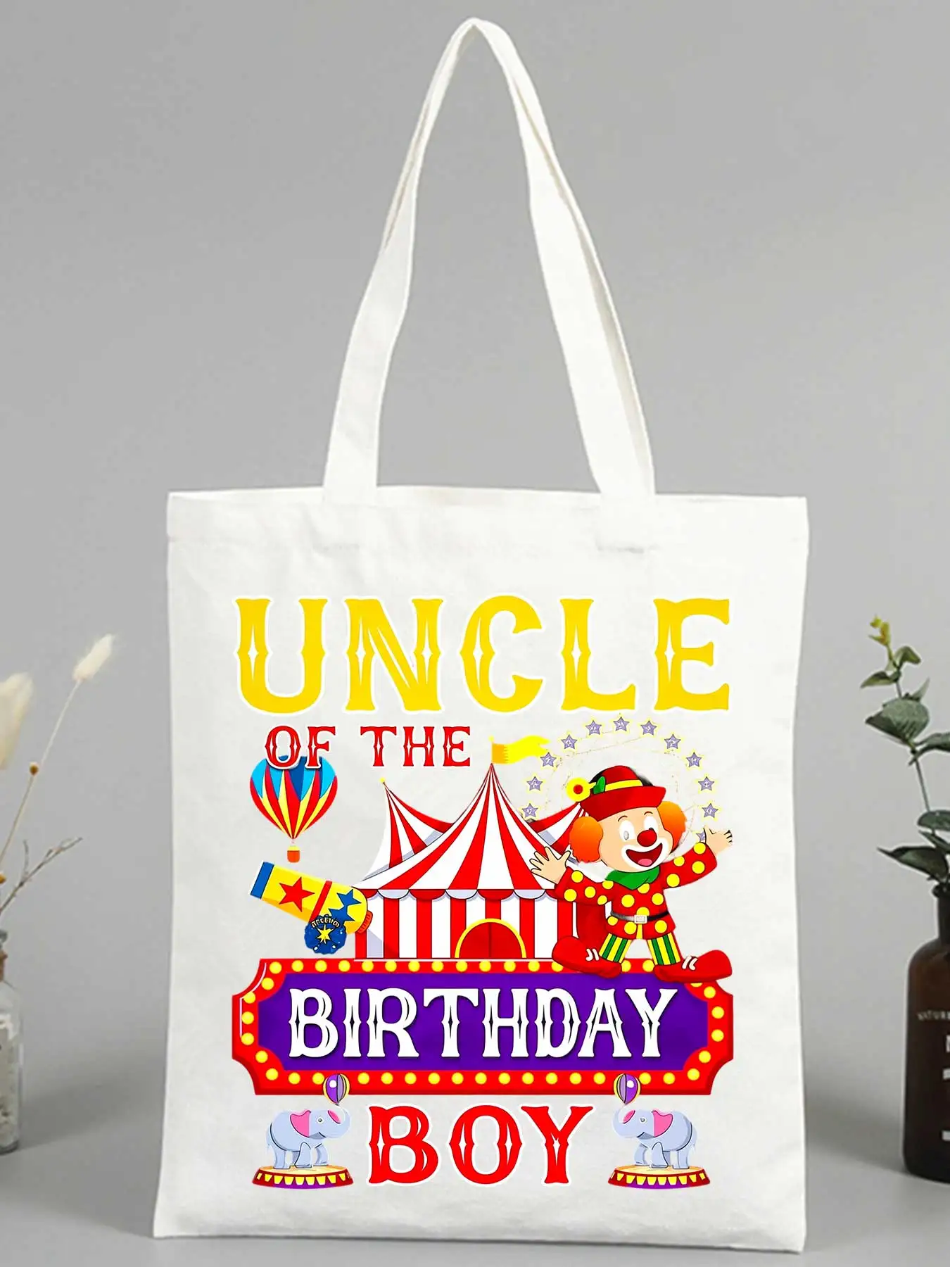 Uncle's canvas tote bag with circus clown and birthday graphics, ideal for party celebrations and casual outings