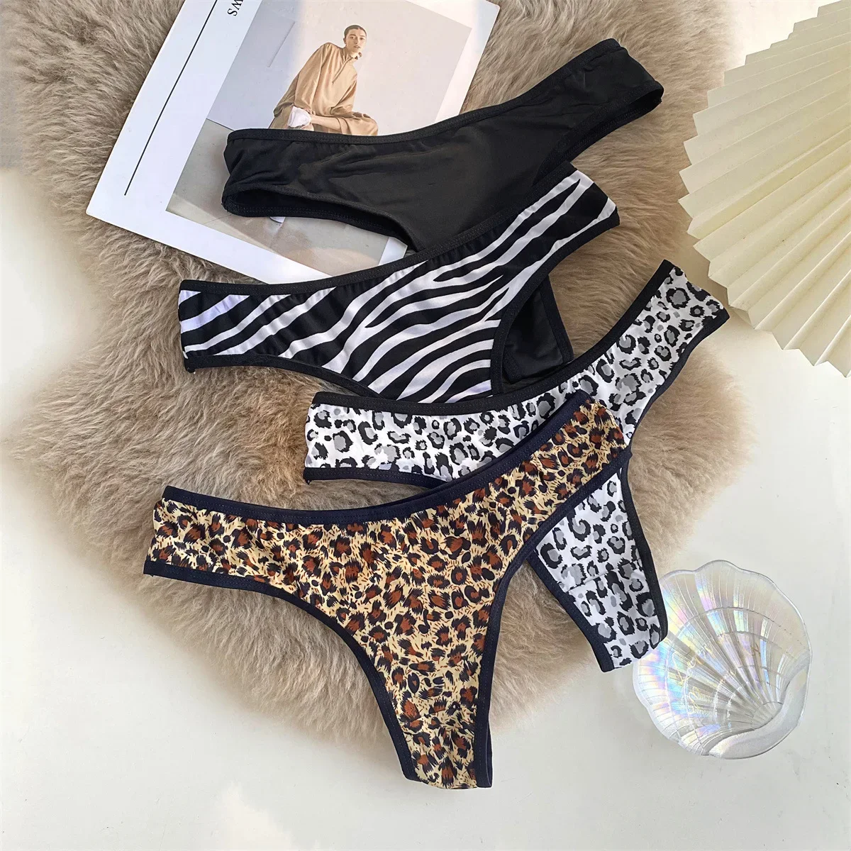 Bragas de encaje de cintura baja para mujer, ropa interior Sexy con estampado de leopardo, tangas caladas de algodón de seda sin costuras, ropa interior femenina