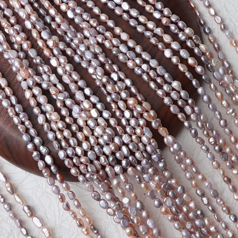 A strand of 4mm straight holes, two-sided smooth mixed-color pearls, approximately 37cm long with about 60 beads.