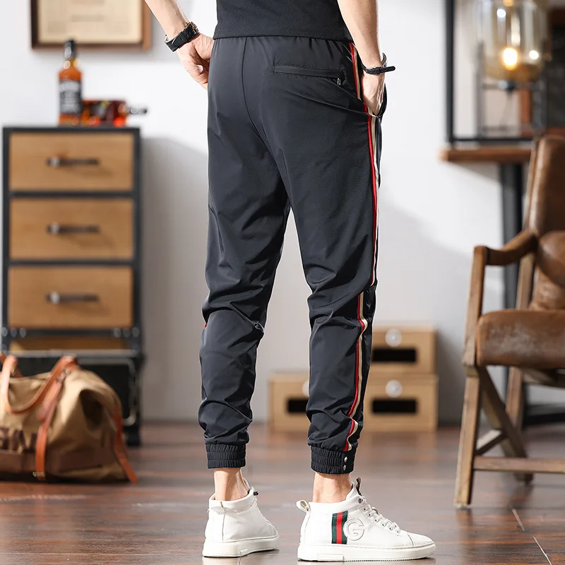 

Модные легкие роскошные спортивные повседневные брюки для мужчин летом, тонкие и модные эластичные облегающие брюки, быстросохнущие.