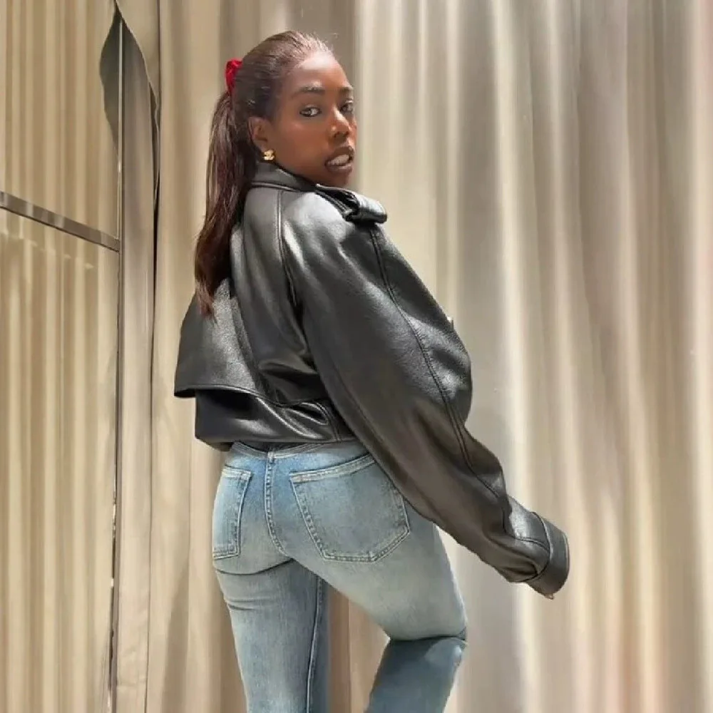 Black Faux Leather Fabric Lapel Design With Front Zipper Closure And Side Pockets Loose Fit Shoulder Design Short And Loose Hem
