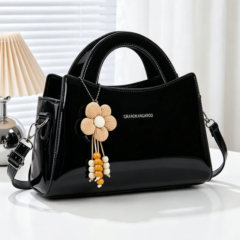 Women's handbags with premium glossy leather texture, women's crossbody bags adorned with cute small flower pendants