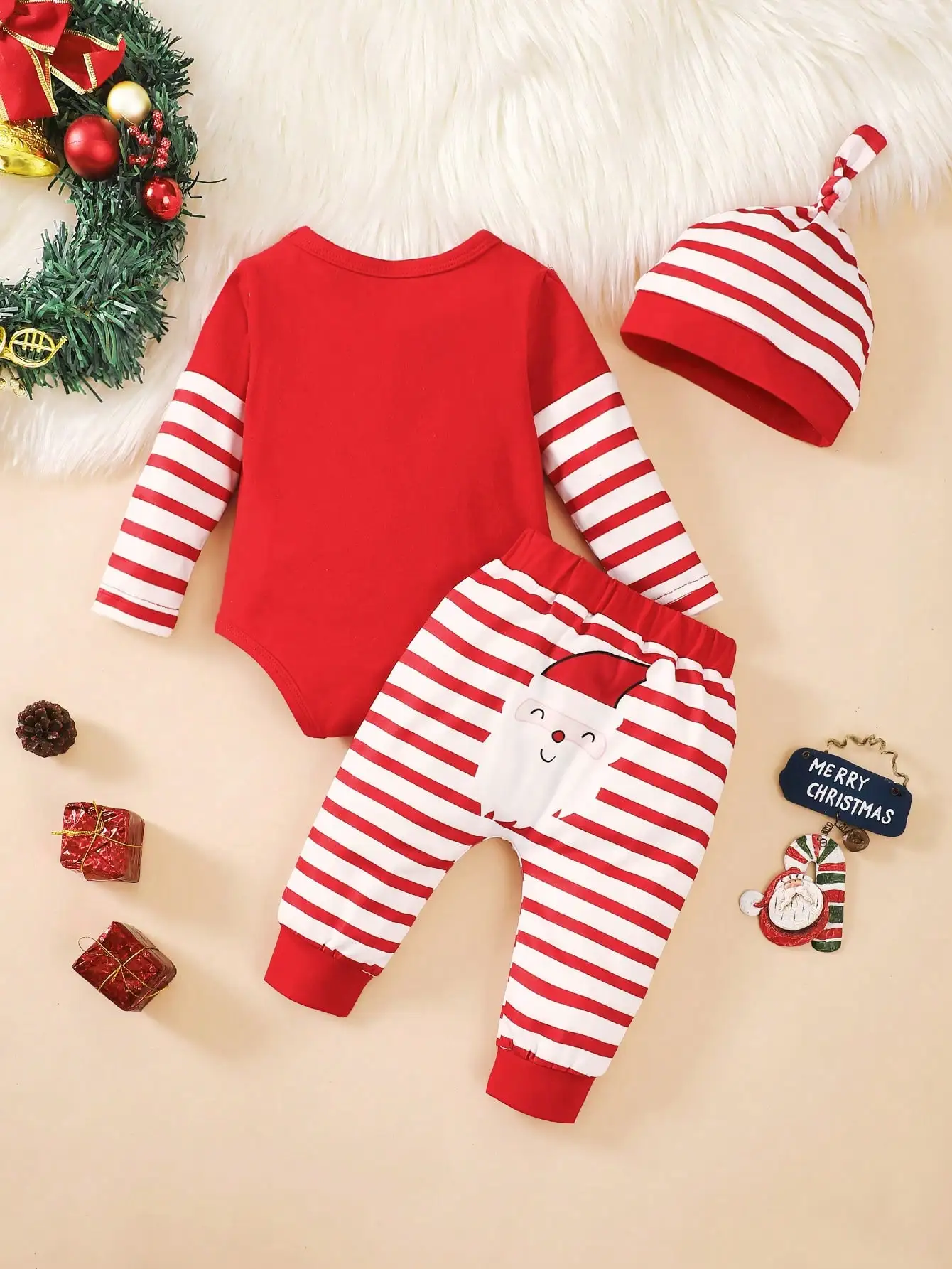 Baby Christmas Three-Piece Set, Red Long-Sleeved Romper with Cute Santa Claus and My First Christmas Letter Print + Striped Pants + Hat, with Snap Buttons at the Crotch for Easy Diaper Changes, Suitable for Baby's Christmas Photoshoots and Holiday Parties.