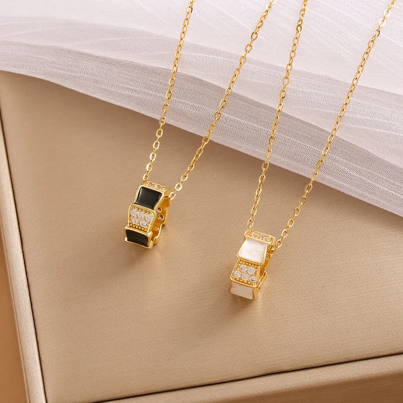 

The 2026 new trendy DIY accessory New black and white mother-of-pearl snake bone diamond-set drop necklace