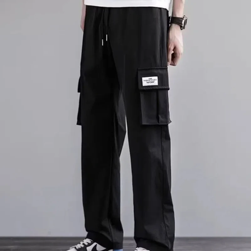 Calça casual sólida de cintura elástica masculina, bolsos retos, estilo coreano, calças largas, tudo combina com roupas novas da moda, primavera e verão