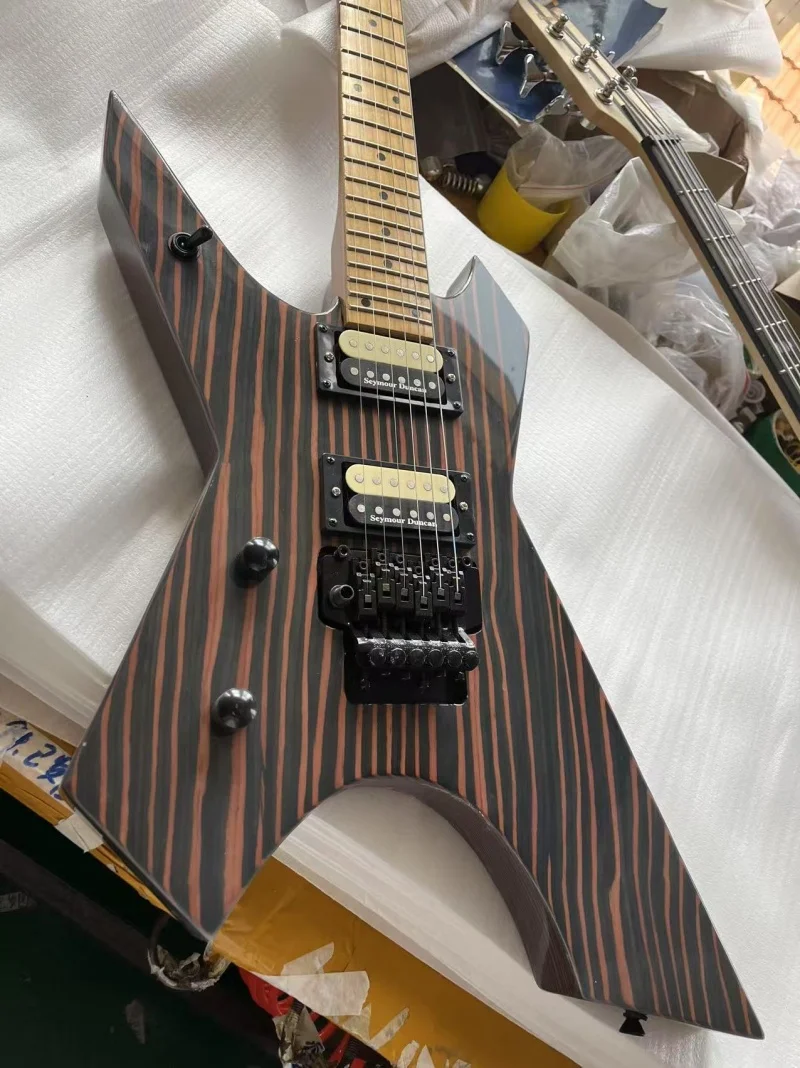 

Backhand 6-string special type guitar, baked maple fingerboard and neck, zebra wood body，Floyd rose bridge,Free delivery