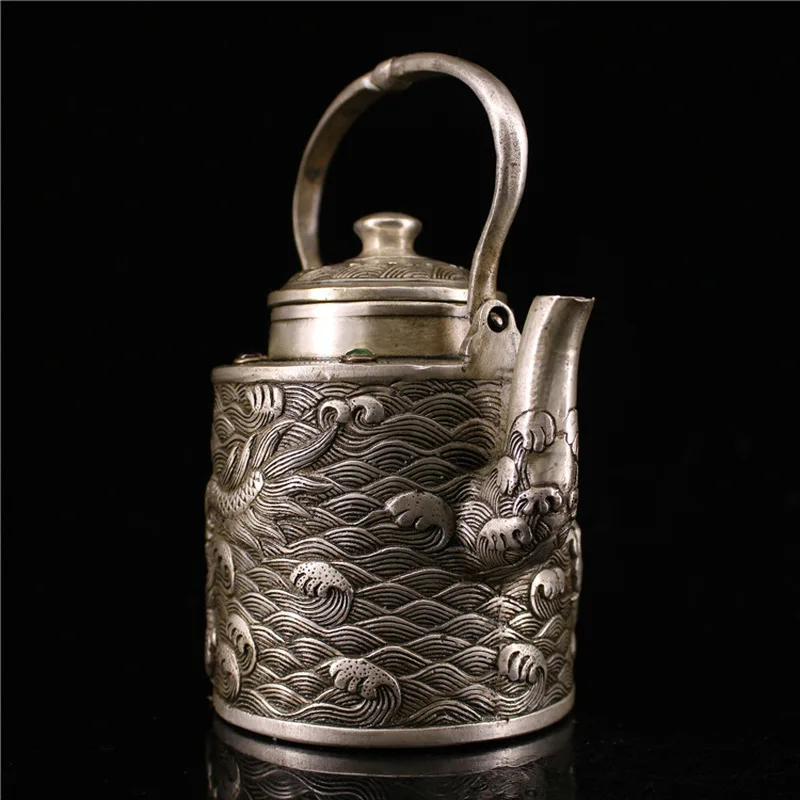 Antique silver teapot and wine pot featuring a dragon playing a pearl, handcrafted by an old silversmith, with a handle, su