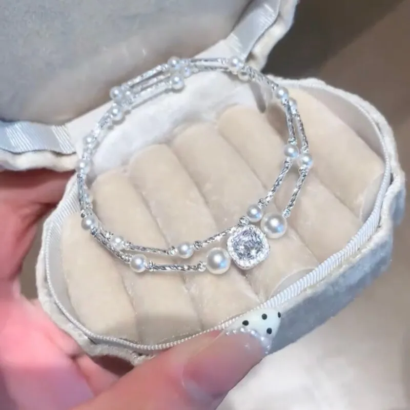 Lustrous Double Strand Pearl Layered Look Glimmering Central Square Pave Stone High Shine Elegant Wrist Accessory