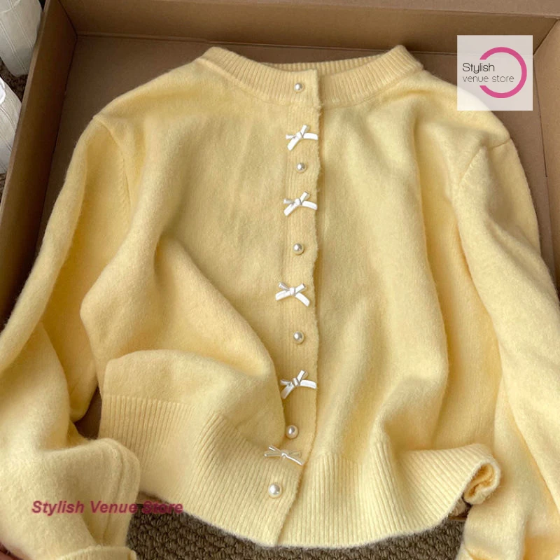 

Korean-style unique cardigan super nice coat wearing bow women's spring and autumn new casual gentle milk yellow sweater.