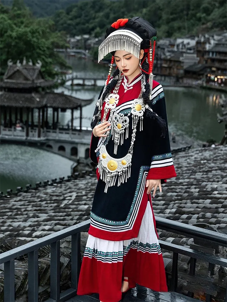 

A complete set of new cotton and linen embroidered traditional ethnic characteristic clothing for travel photography