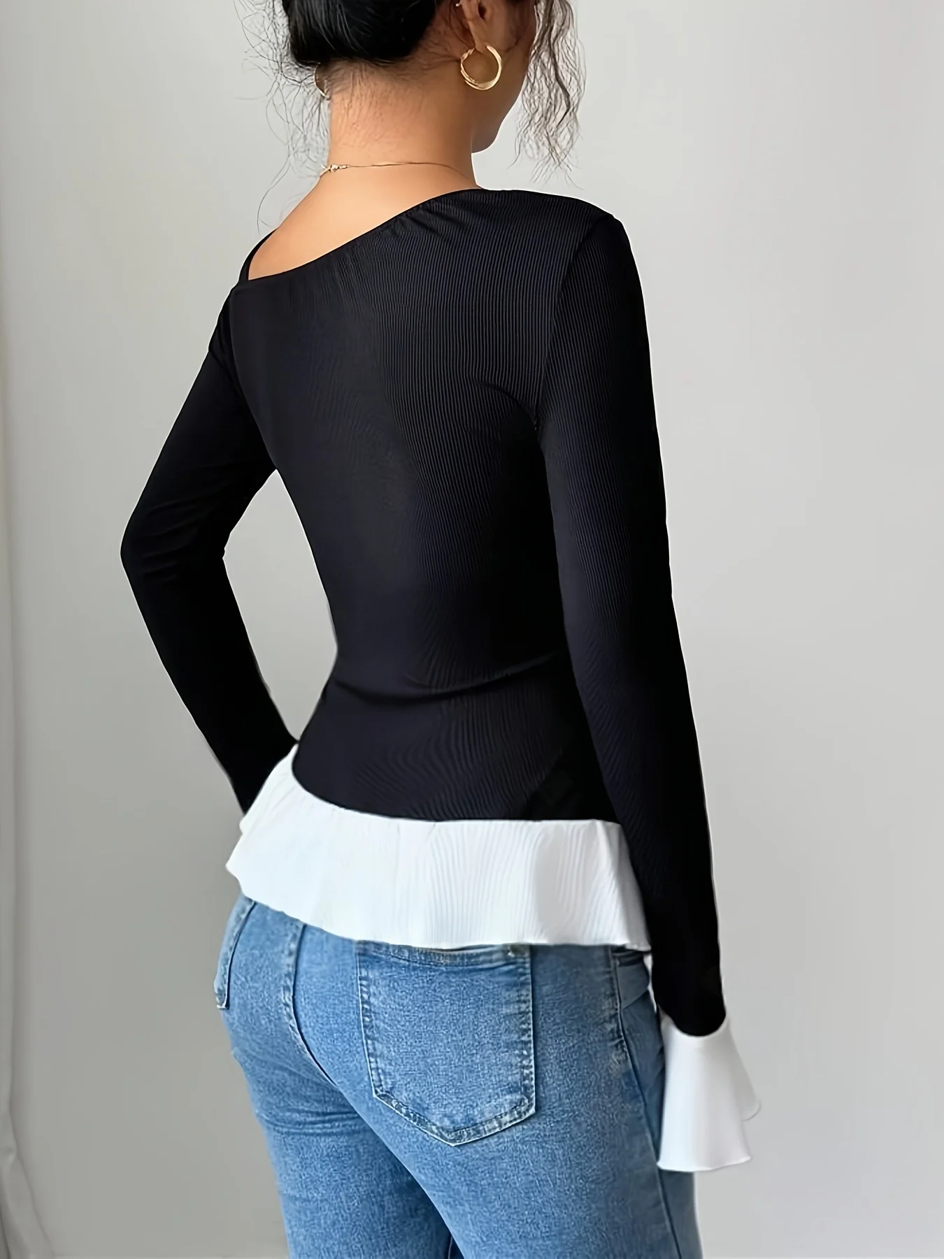 Elegant and fashionable off shoulder long sleeved T-shirt with contrasting color and asymmetrical hem top